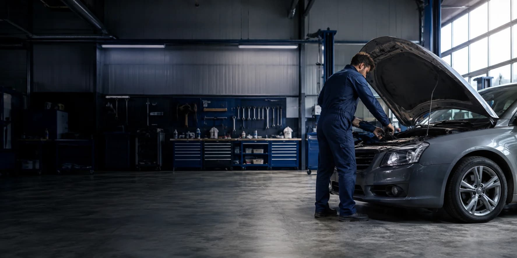Automotive technician working in a professional service workshop